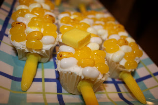 Up close picture of the cupcakes on a striped platter.