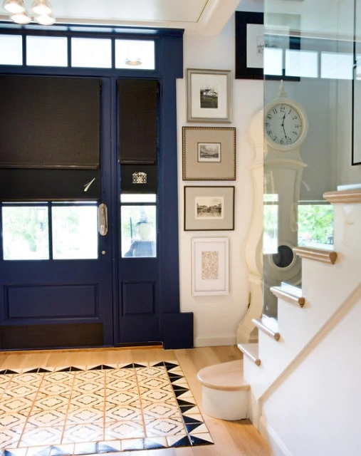 Robert McArthur Studios - Entryway with Blue Door and cement tile floor
