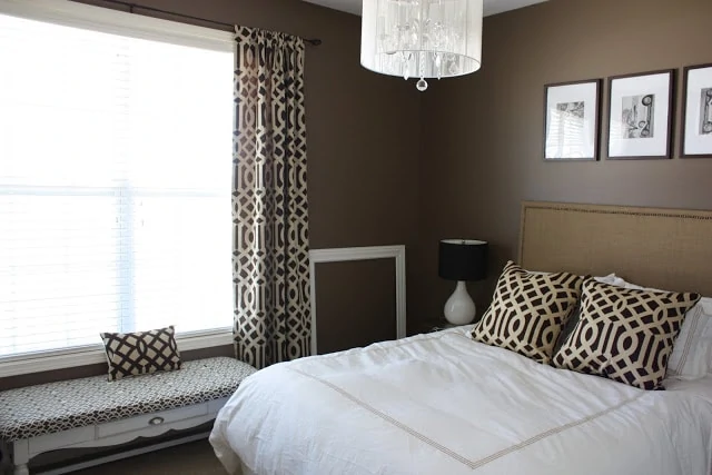 Guest bedroom with Behr Mocha Latte brown walls and white bedding