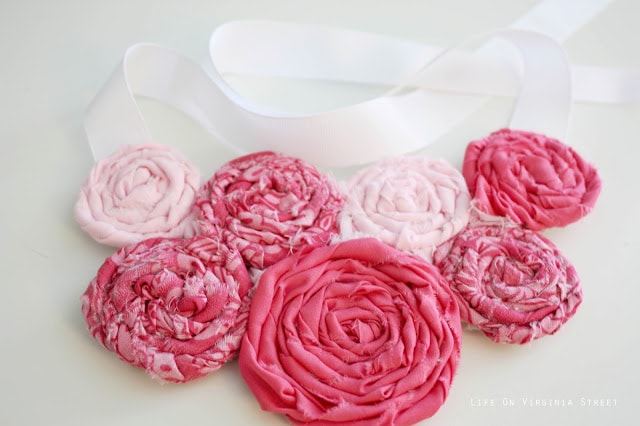 Pink floral rosette bib necklace
