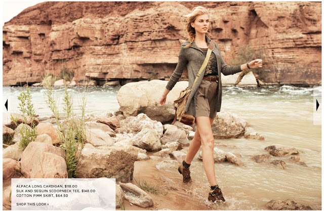 A woman in shorts and sequins walking into the water.