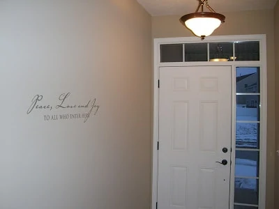 A white door with a light in front of the door.