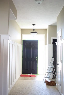 Painting the front door black.