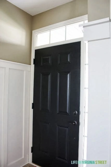 An interior front door painted Valspar Dark Kettle Black.
