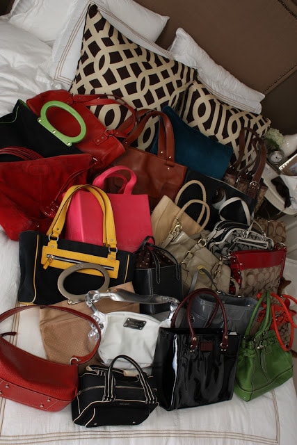 Up close picture of the purses on the bed.