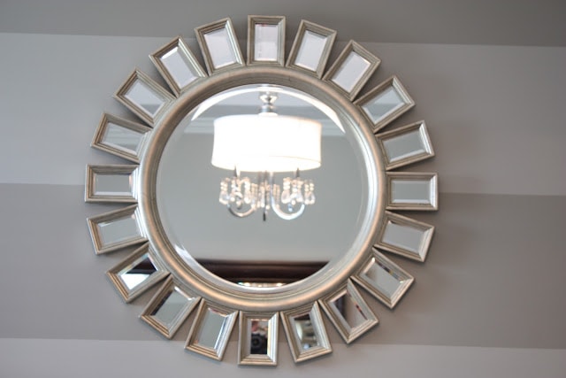 A close up picture of the round sunburst mirror.