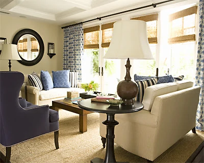White and blue couches in the living room with touches wood.