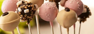 Multi colored cake pops standing up.