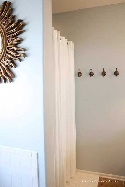 Light Gray Master Bathroom with Gold and Bronze Accents and the sunburst mirror.