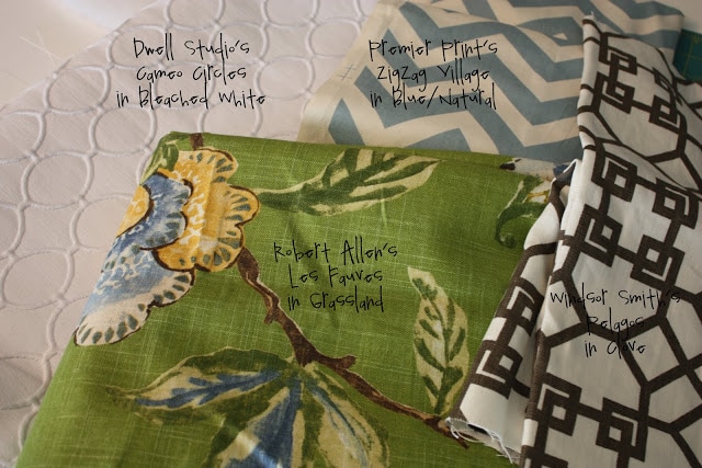 Mulit colored and patterned fabrics on the table.