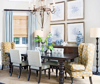 Bright dining room wit chandelier, and Chinoise vases on the hutch.