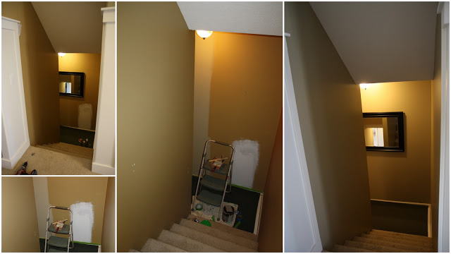 A long stairway with stepladder and paint cans.