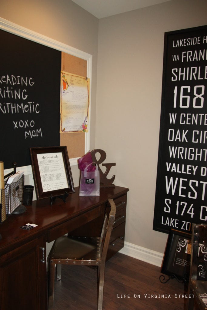 A small office with a wooden desk and chair.