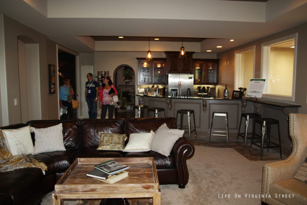 A leather couch in the downstairs recreation room.