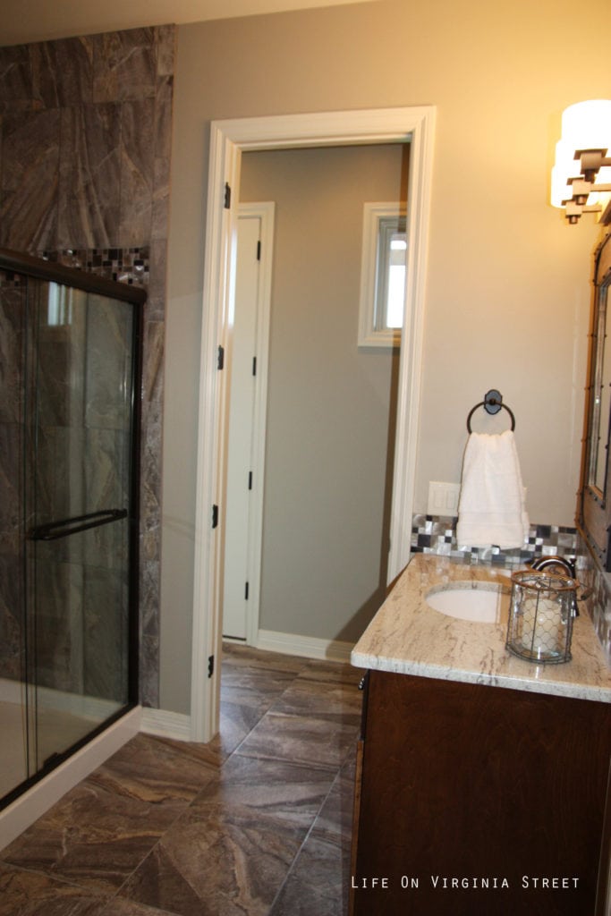 A glass shower in the downstairs bathroom.
