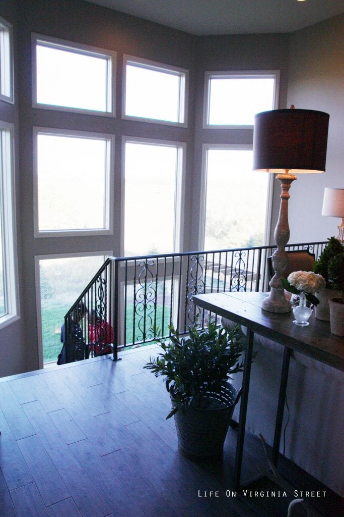 Large windows just off the staircase leading to the downstairs.