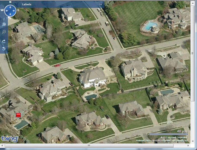 Aerial view of a street in Virginia with inground pools.