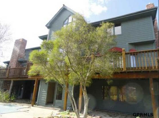 The outside of a grey blue house.