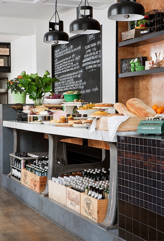 Bread, pies and vases on bakery shelf.