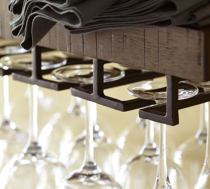 Wooden shelf with metal for hanging wine glasses and cloth napkins on the shelf too.