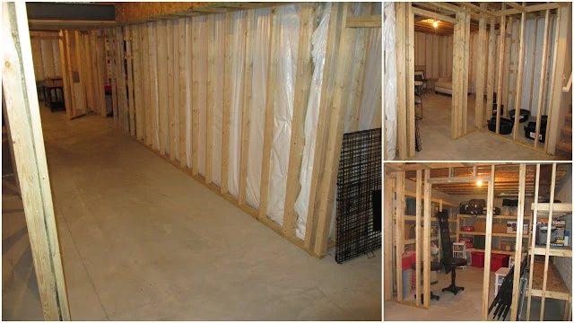 Basement with walls down to the studs of the wood, and concrete floor.
