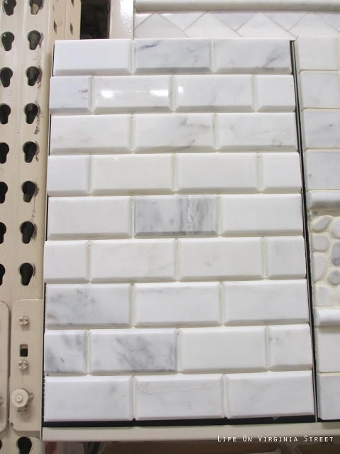 Grecian White Marble Subway Tile which is white with flecks of gray.