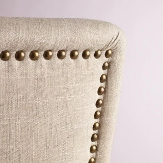 Up close picture of the rivet detailing on the back of the chair.
