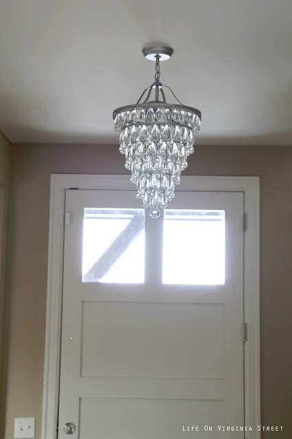Cone shaped crystal chandelier in an entryway