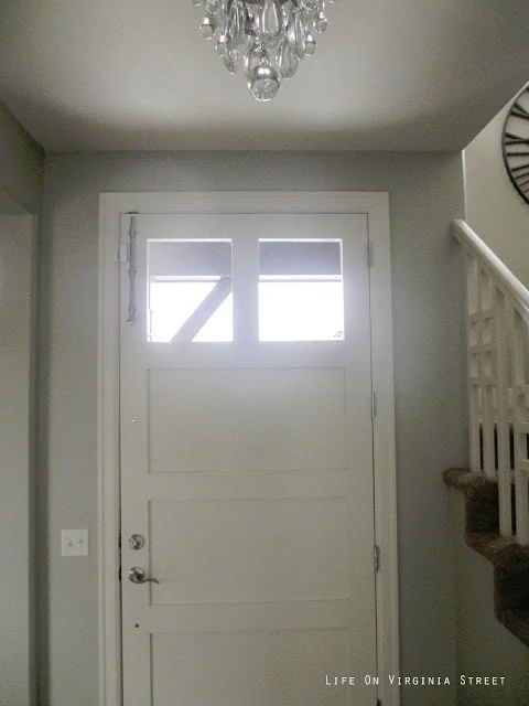 Front door with a surface bolt.