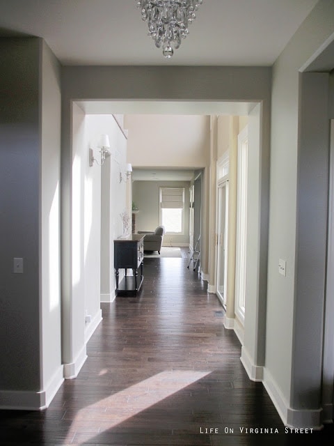 Hallway painted Behr Castle Path with Dark Oak Hardwood Floors