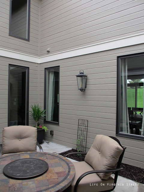 A round outdoor patio table with chairs.