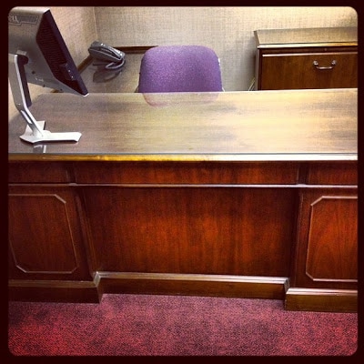 A wooden desk before being painted.
