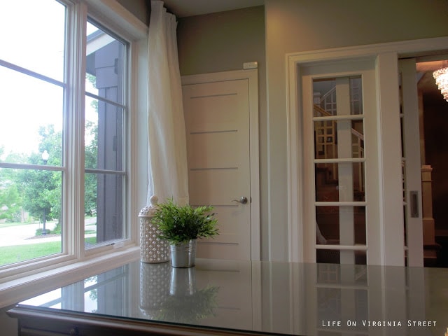 French doors and large windows in home office.