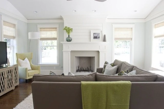 White fireplace with shiplap and Healing Aloe walls