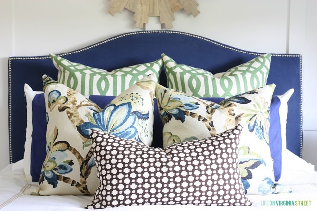 Guest Bedroom with A Blue Headboard and Designer Pillows