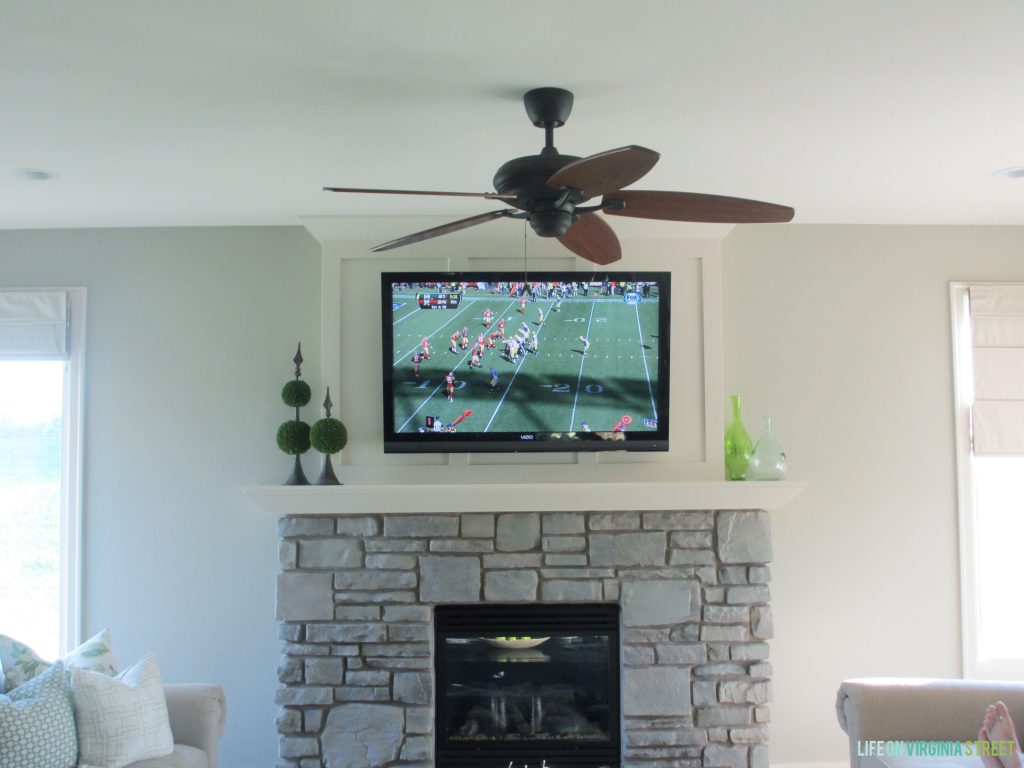 The gray-washed fireplace is all done