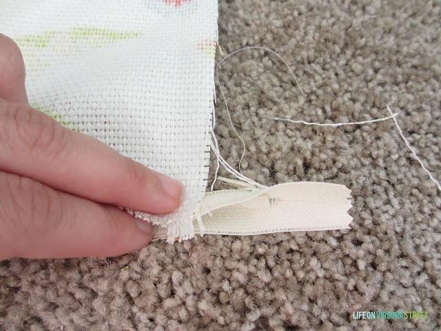 Pinching the zipper into the fabric.