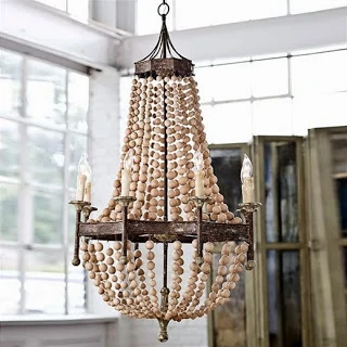 Wood and metal chandelier with faux candle lights on it.