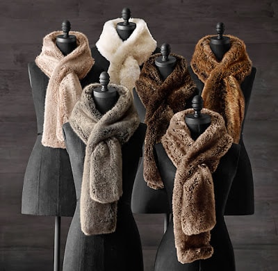 Faux fur scarves around mannequins.
