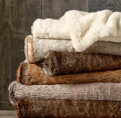 Faux fur blankets folded in a stack.