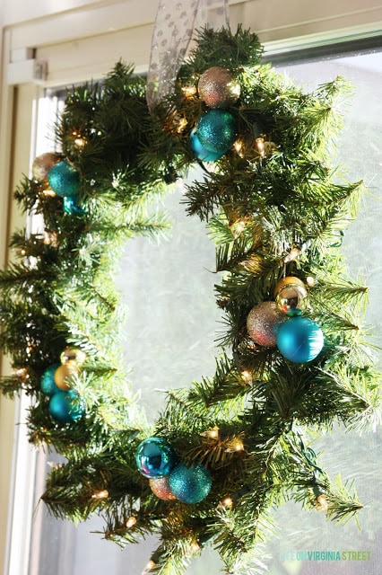 Up close picture of the wreath, hanging in the window.