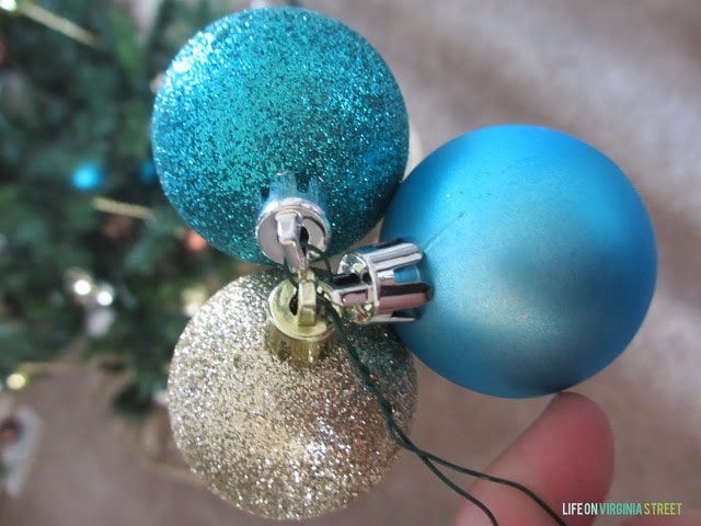 Blue, sparkly blue, and sparkly silver Christmas ornaments.