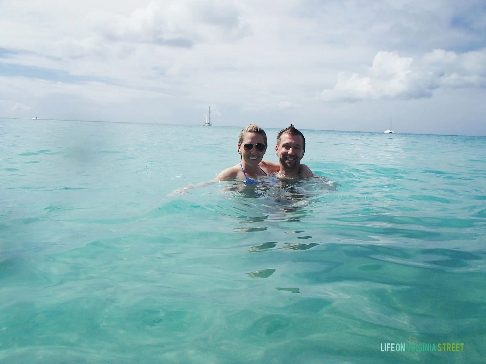 A couple swimming in the ocean.