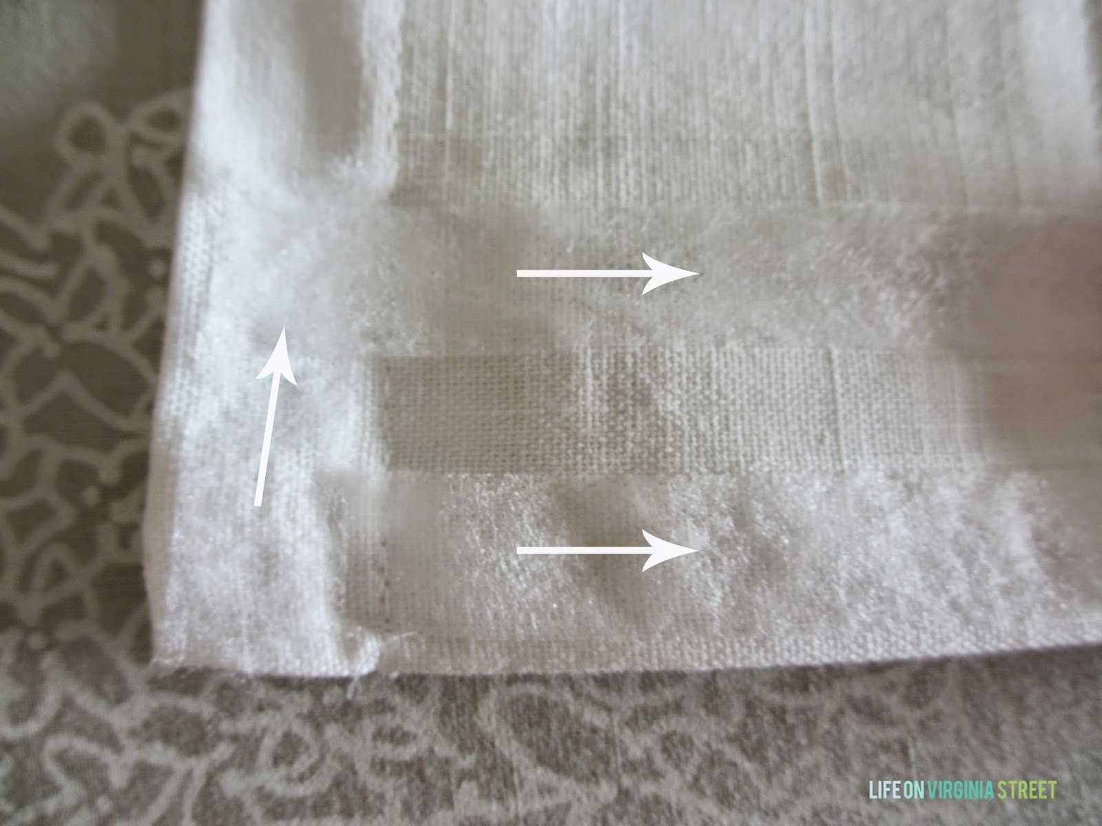 Arrows showing where to put the Stitch Tape on the fabric.