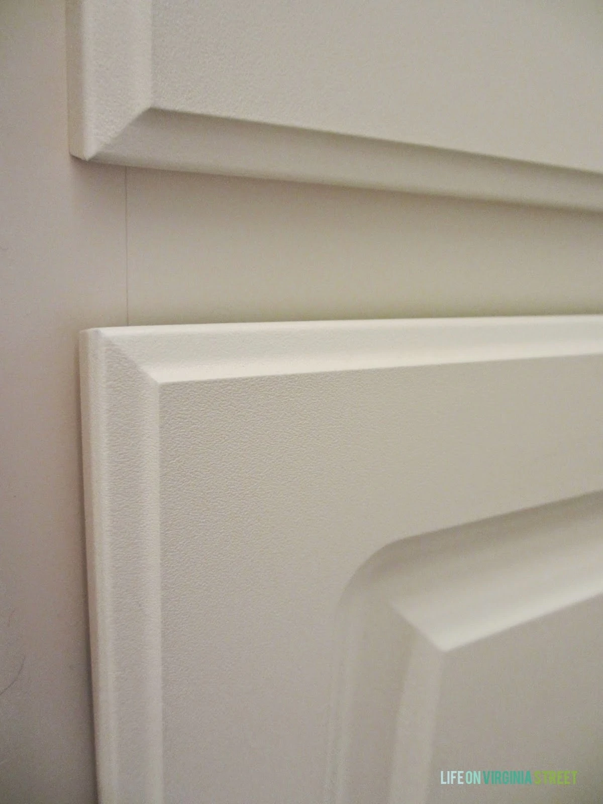 Close up of the cream white laminate bathroom cabinets I'm planning to paint.