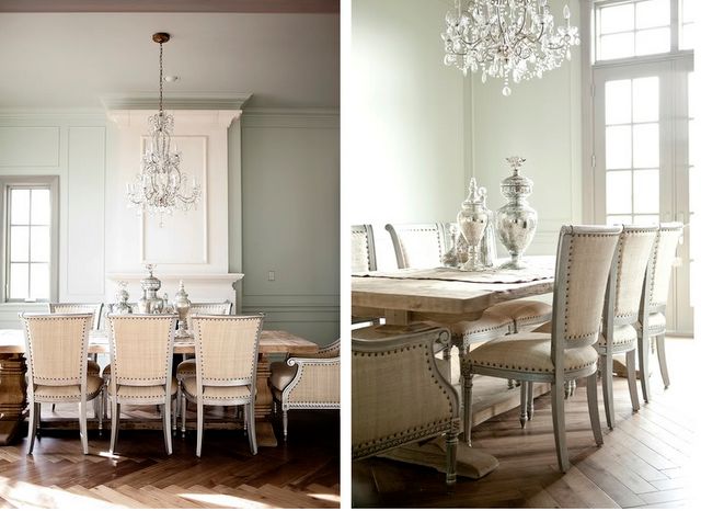 A large chandelier in the dining room with a hardwood floor in a chevron pattern.
