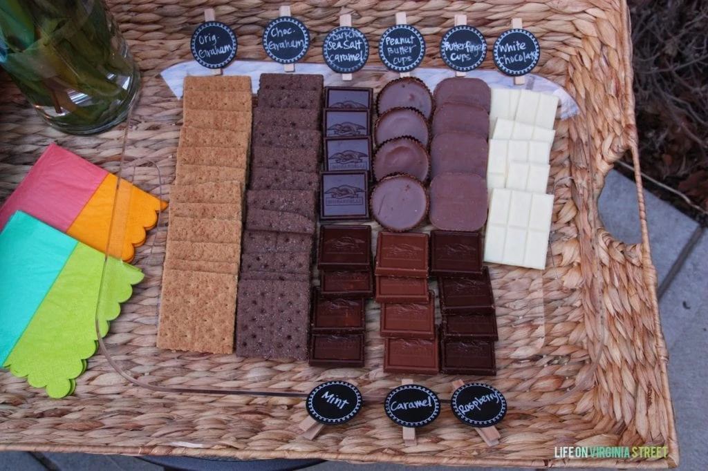 The different types of chocolate and wafers in a tray on the patio.
