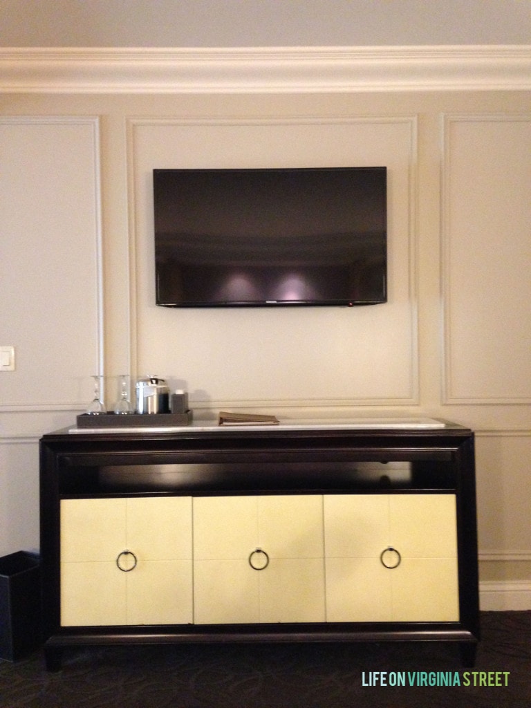 A console table underneath the TV in the bedroom.