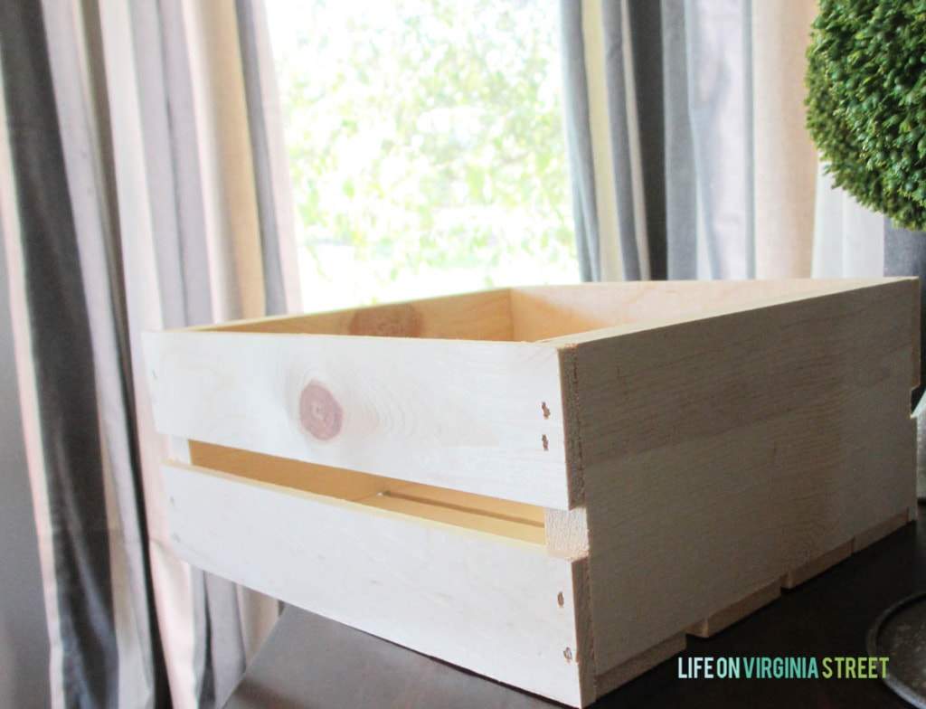 Plain wooden crate on table.