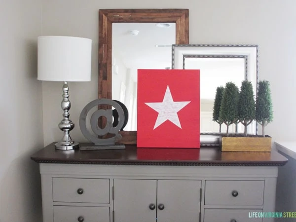 The white star on a red background on the side table.